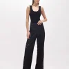 FLARED PANTS WITH CUT-OUT ROSE DESIGN