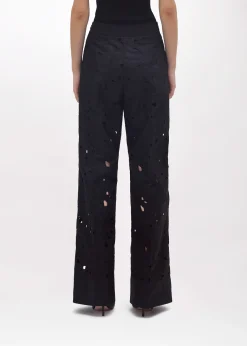 FLARED PANTS WITH CUT-OUT ROSE DESIGN