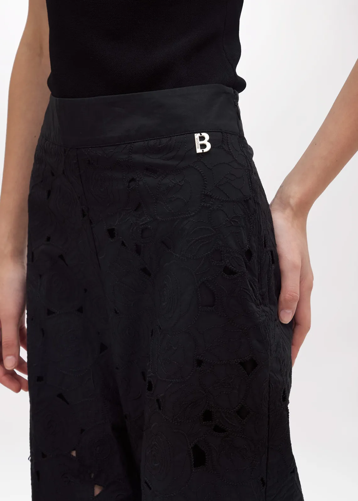FLARED PANTS WITH CUT-OUT ROSE DESIGN